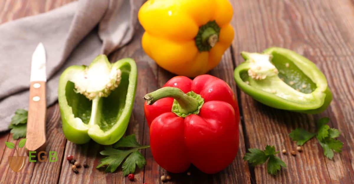 Red, Yellow and Green Bell Peppers are being prepared.
