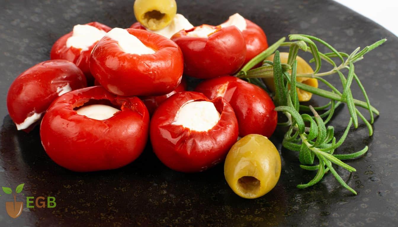 Cooked cherry peppers stuffed with delicious melted goats cheese