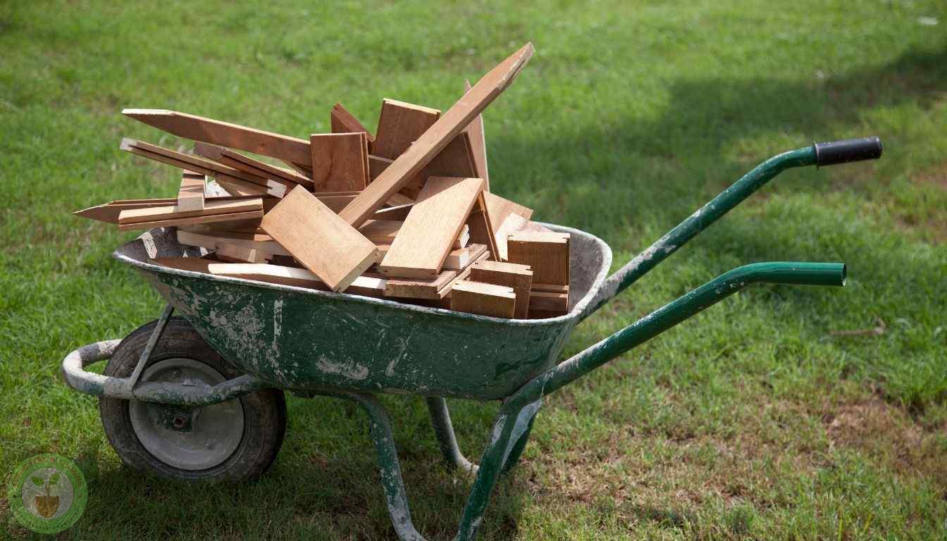 Steel whellbarrow hauling wooden planks